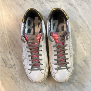 P448 White and Pink Sneakers with Gray Laces
Size 10